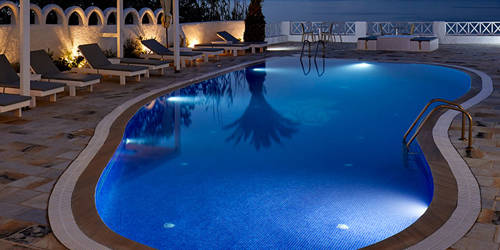 
Santorini View Hotel swimming pool area with sea view at night