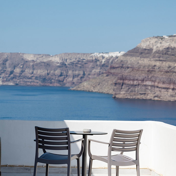 Private balcony with chairs and Caldera sea view at Santorini View Hotel in Akrotiri, Santorini