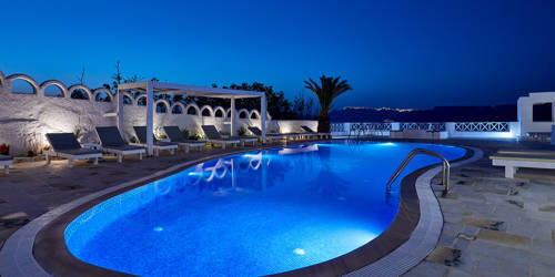 
Santorini View Hotel swimming pool with lights, at night