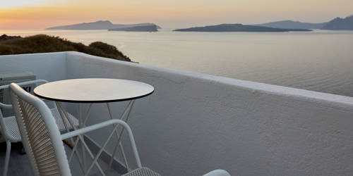 
Santorini View Hotel balcony with sunset and sea view