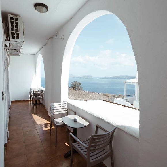 Shared balcony with Caldera sea view and seating area for Classic Double rooms at Santorini View Hotel