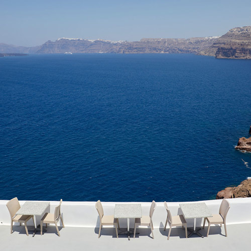  
Santorini View Hotel terrace with table seats and caldera view