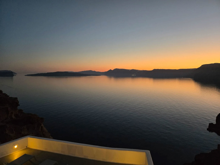 Sunset view over the Caldera from Santorini View Hotel in Akrotiri with tranquil evening colors