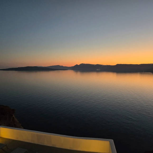 Sunset view over the Caldera from Santorini View Hotel in Akrotiri with tranquil evening colors
