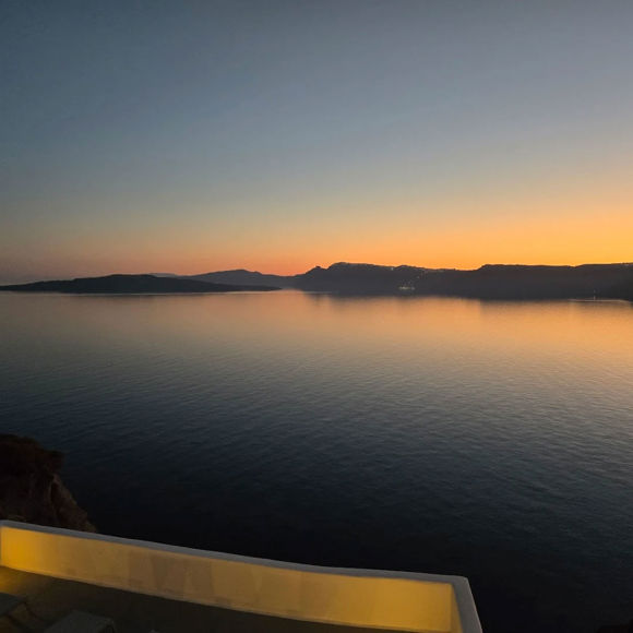 Sunset view over the Caldera from Santorini View Hotel in Akrotiri with tranquil evening colors