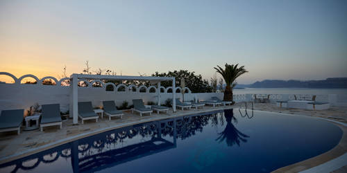 
Santorini View Hotel swimming pool with sea view, at sunset time
