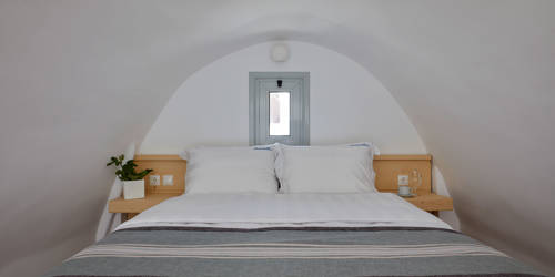 
Santorini View Hotel double bed with white and grey linen and bedside tables