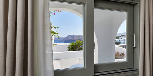 
Santorini View Hotel windows with gray frames and sea view