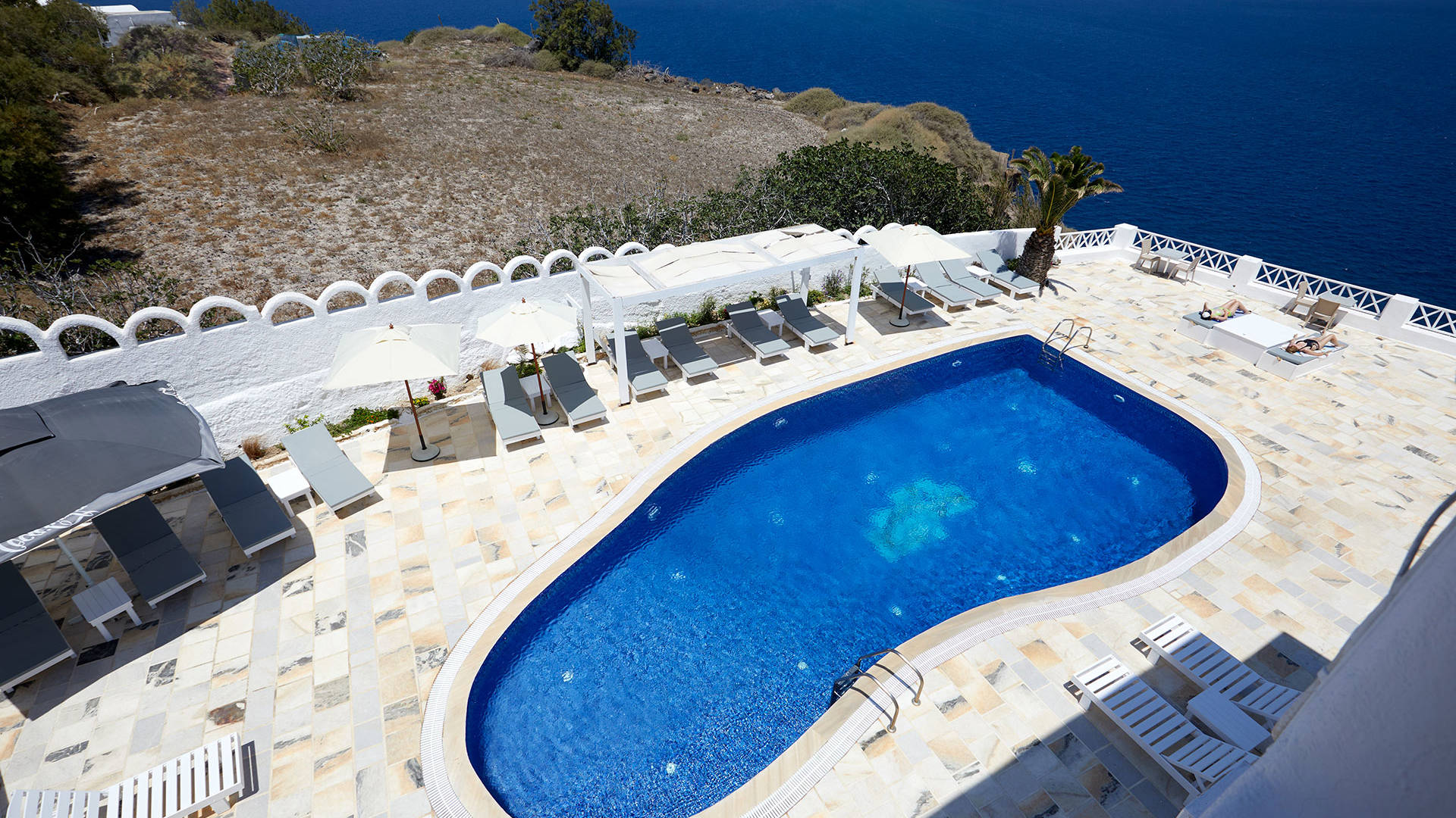 
Santorini View Hotel swimming pool area with caldera view