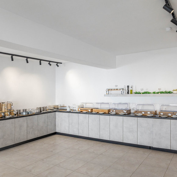 Santorini View Hotel breakfast buffet with modern counters offering a variety of cereals and baked goods