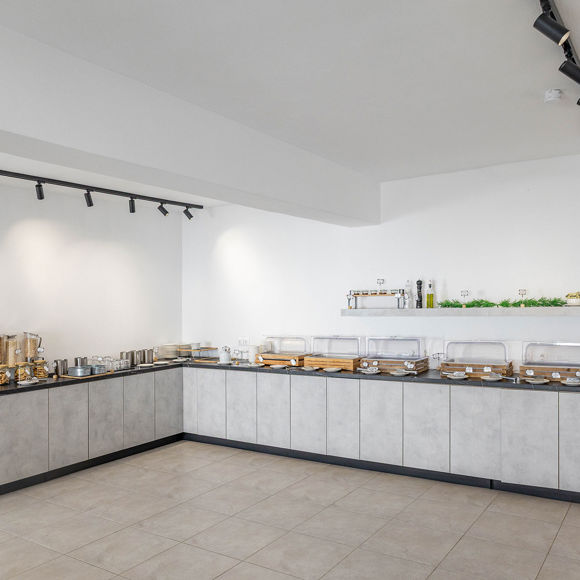 Santorini View Hotel breakfast buffet with modern counters offering a variety of cereals and baked goods