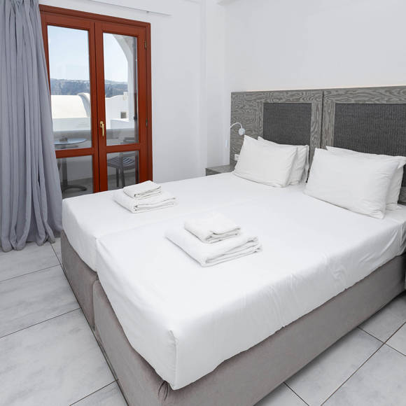 Bright Standard room with twin beds and private balcony at Santorini View Hotel in Akrotiri