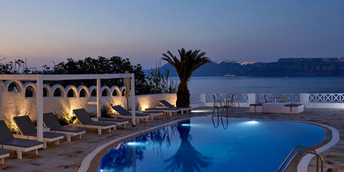 
Santorini View Hotel swimming pool, sunbeds and sea at evening