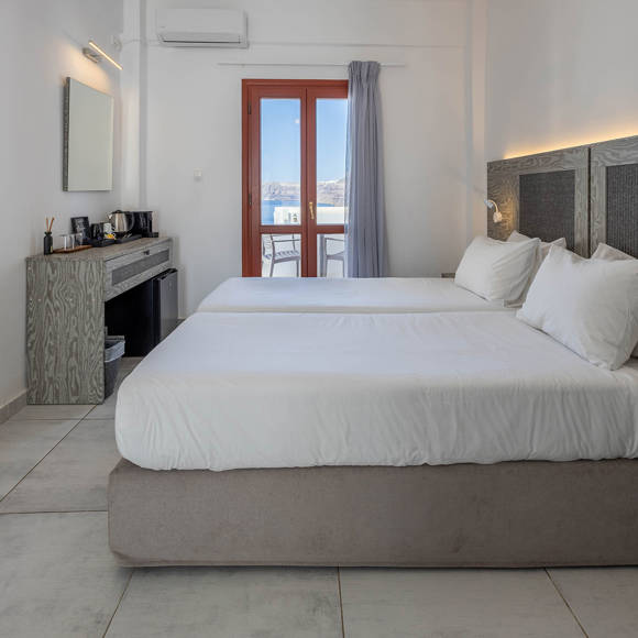 Standard Room with twin beds and private balcony overlooking the sea at Santorini View Hotel