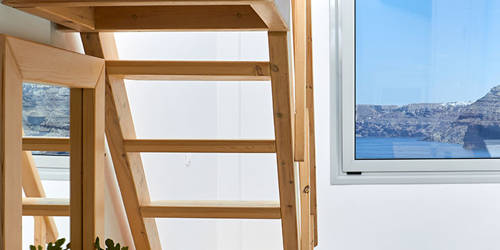 
Santorini View Hotel wooden stairs to a single bed bedroom with sea view