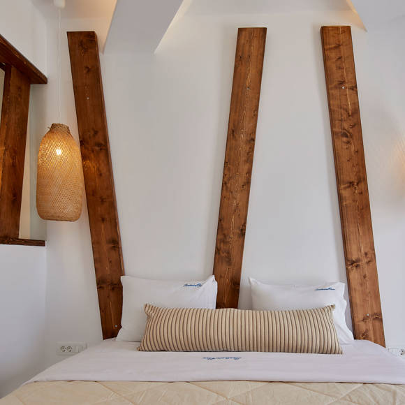 Elegant Superior Double room at Santorini View Hotel with wooden details and cozy lighting