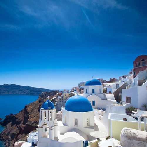  
Santorini's vista: The white houses of the villages stand tall above the craters, providing a striking contrast against the azure waters of the Aegean.