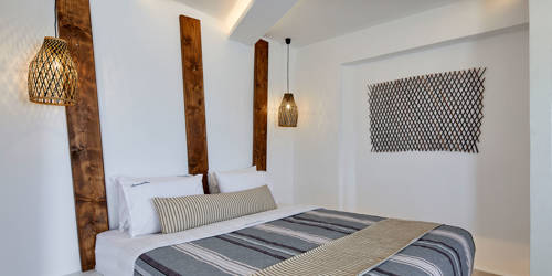 
Santorini View Hotel with king size bed and striped linen