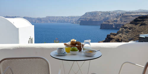 
Santorini View Hotel terrace with table seats for breakfast with sea view