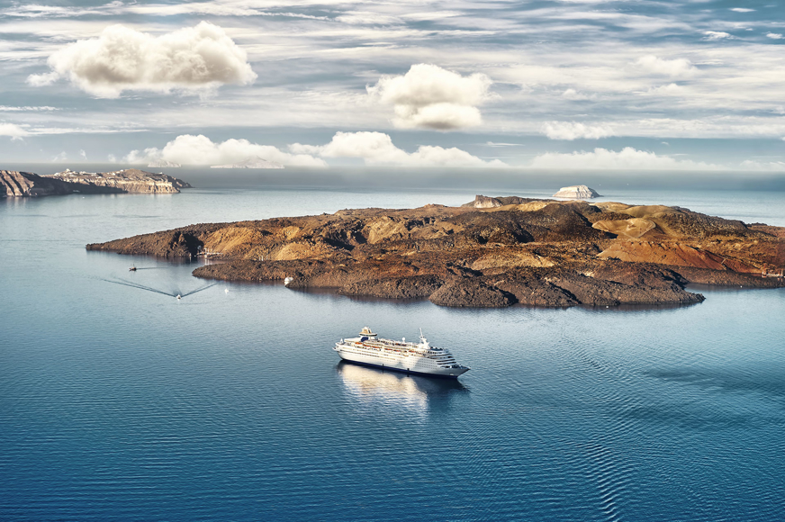 Infinite blue of the sea meets the lush green craters of the island, creating an unforgettable image