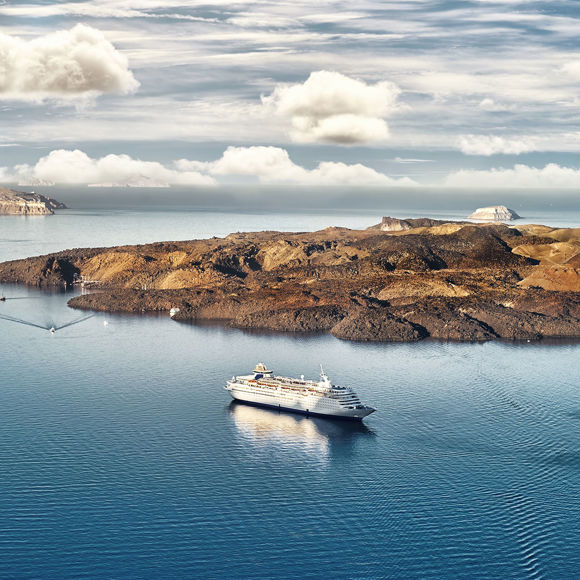 Infinite blue of the sea meets the lush green craters of the island, creating an unforgettable image