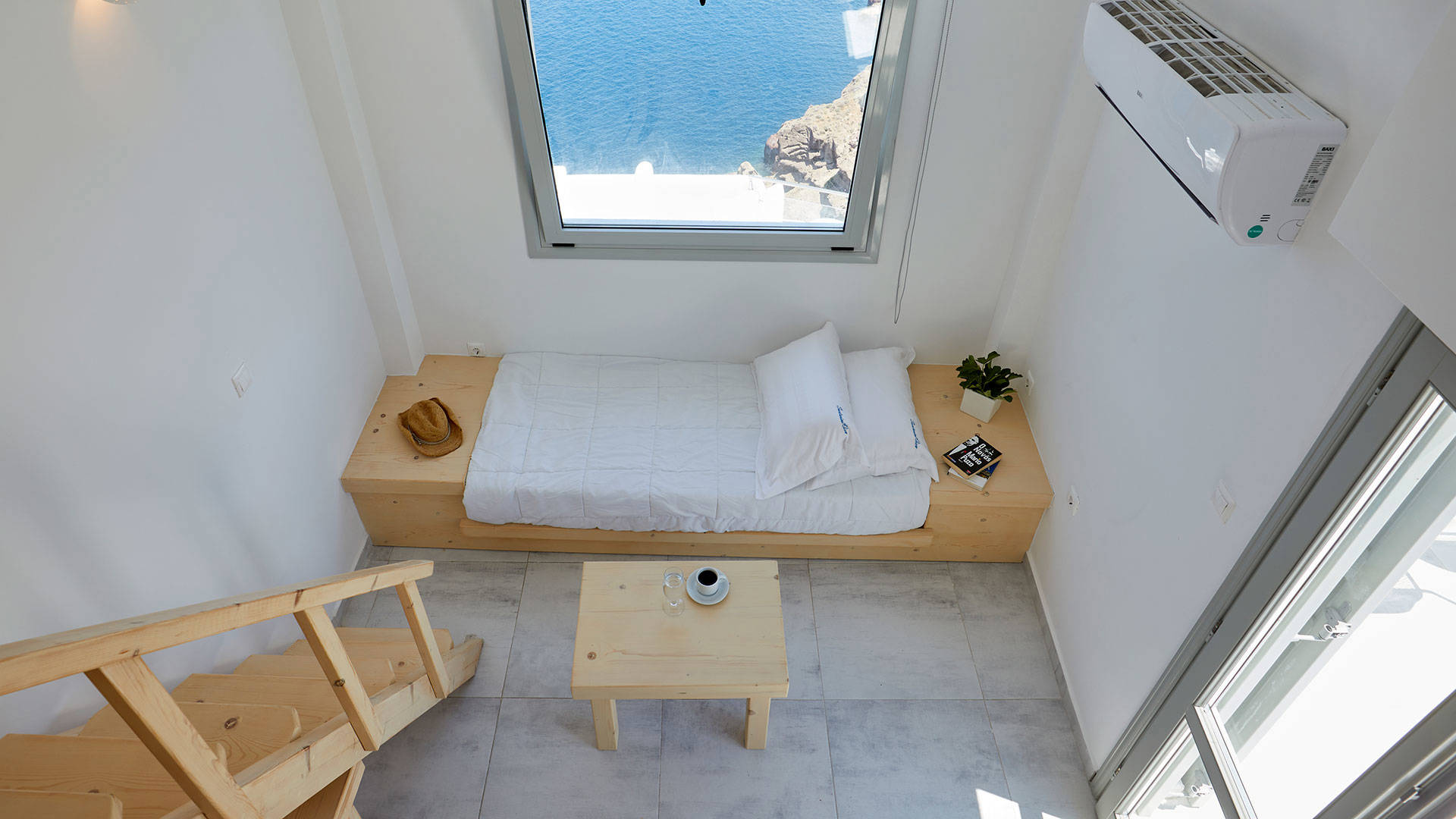 
Santorini View Hotel bedroom with single bed and big window with sea view